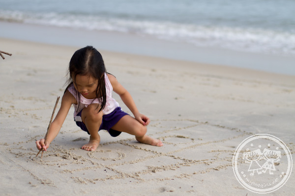 Zaria drawing at the beach
